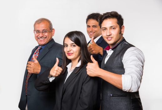 Indian smart Business people OR lawyer in suit standing as a team, isolated over white background, looking at camera